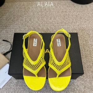 Alaia Fishnet Thong Sandals in Yellow
