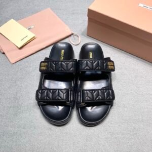 Miu Miu Sandals in Black Gold