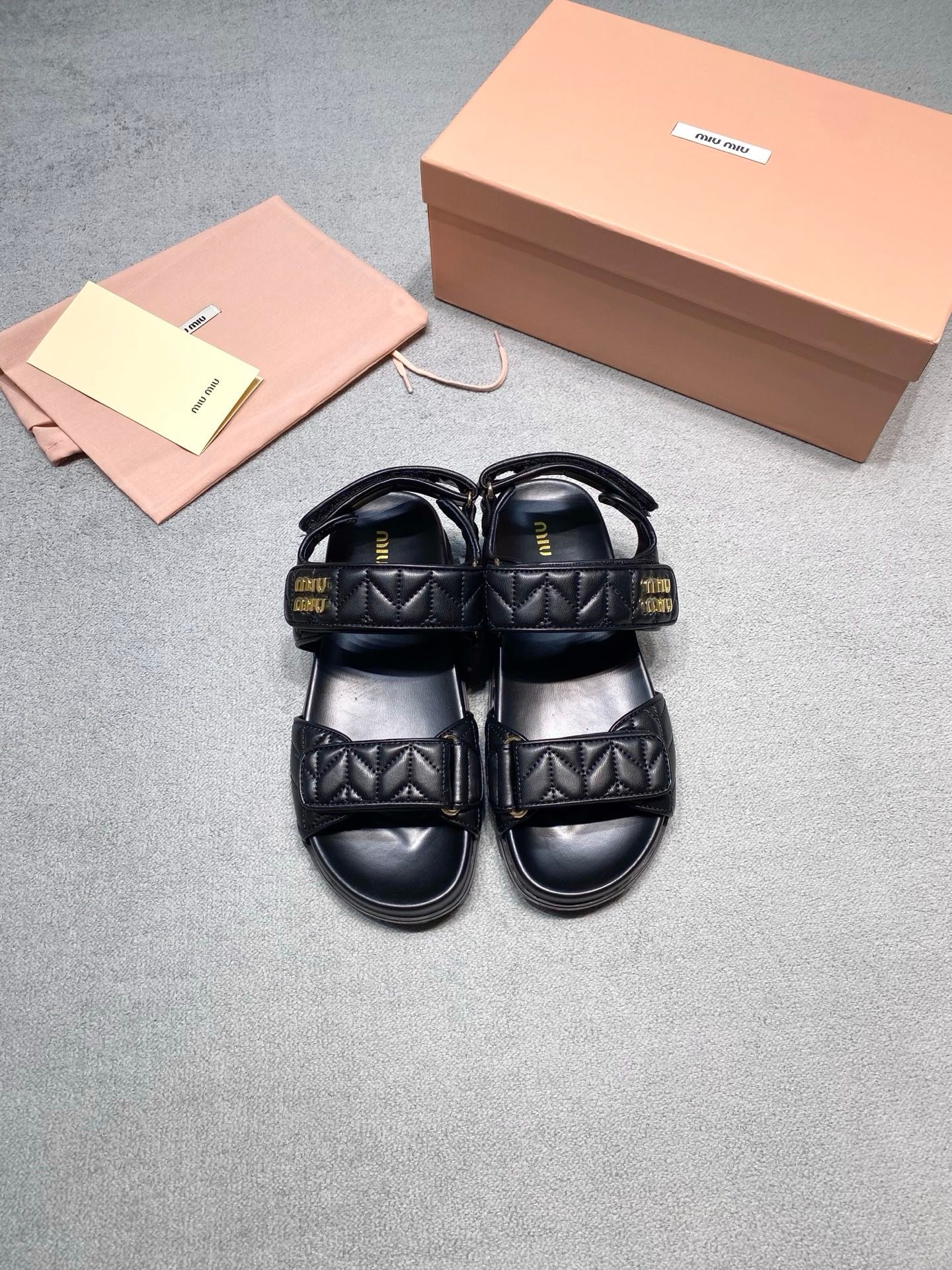 Miu Miu Sandals in Black Gold